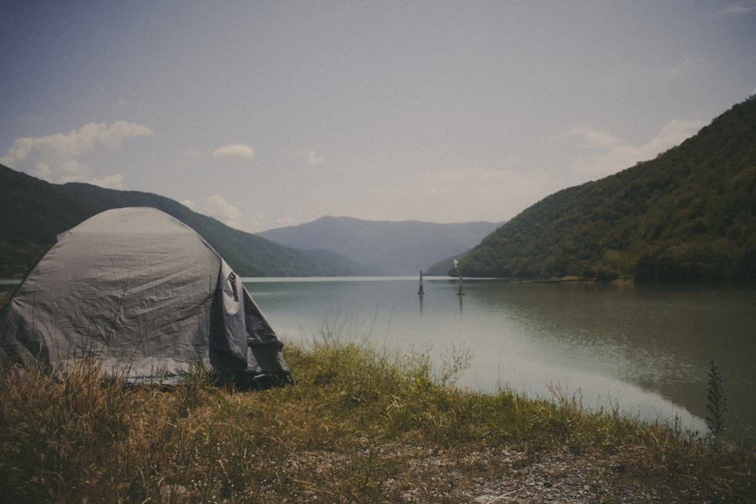 a tent on a lake on The Frugal Camper