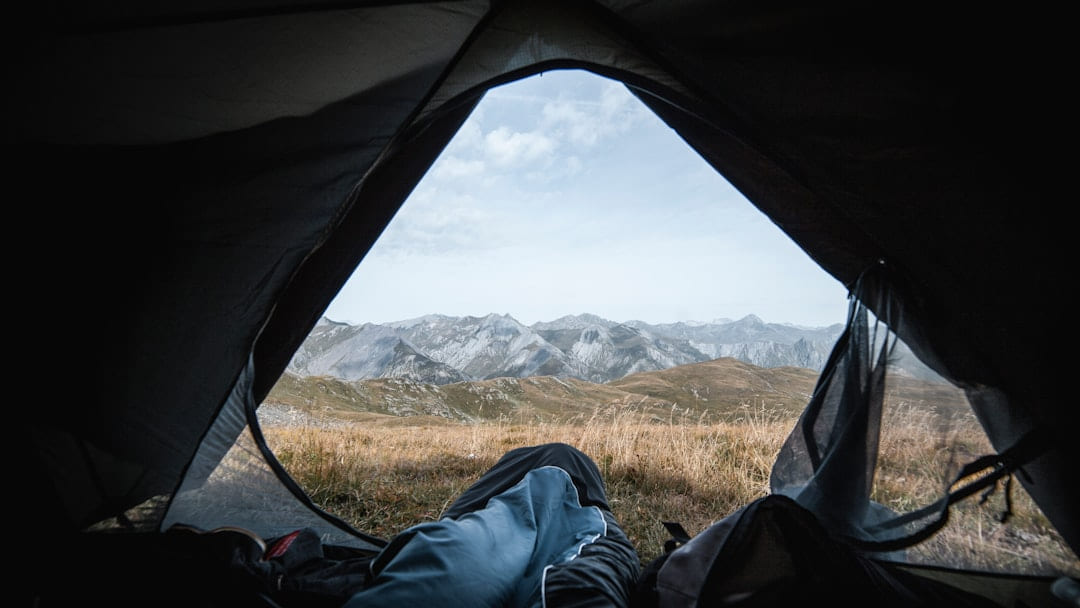 man in tent on The Frugal Camper